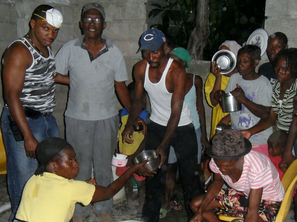 Food relief distribution scene showing direct aid in action